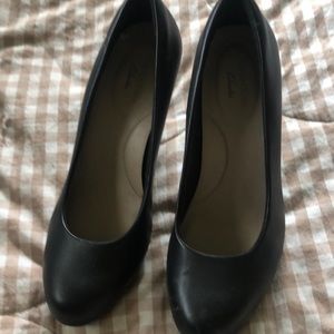 Clark’s black leather heels.  6M
